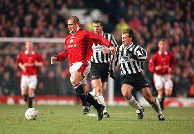 Eric Cantona, left, and Didier Deschamps had different views on carrying drinks. Shutterstock