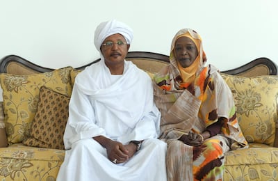 From left, Elgorashi Muneim and his wife Nadia Abdullah Majid, a heart patient, at her home in Abu Dhabi. Khushnum Bhandari for The National