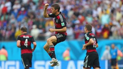 Thomas Muller of Germany, in air, celebrates scoring his team's lone goal in a 1-0 win over the US on Thursday at the 2014 World Cup in Recife, Brazil. Martin Rose / Getty Images