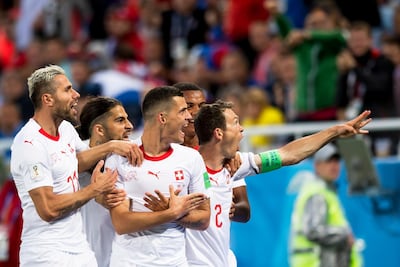 epa06831890 Switzerland's midfielder Granit Xhaka (C) celebrates with his teammates after scoring the 1-1 equalizer during the FIFA World Cup 2018 group E preliminary round soccer match between Switzerland and Serbia in Kaliningrad, Russia, 22 June 2018. (RESTRICTIONS APPLY: Editorial Use Only, not used in association with any commercial entity - Images must not be used in any form of alert service or push service of any kind including via mobile alert services, downloads to mobile devices or MMS messaging - Images must appear as still images and must not emulate match action video footage - No alteration is made to, and no text or image is superimposed over, any published image which: (a) intentionally obscures or removes a sponsor identification image; or (b) adds or overlays the commercial identification of any third party which is not officially associated with the FIFA World Cup) EPA/LAURENT GILLIERON EDITORIAL USE ONLY