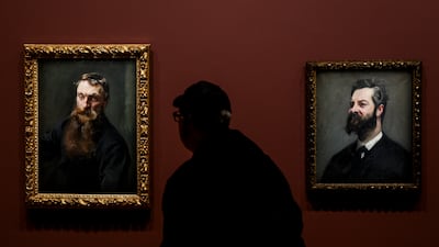 Portraits of French sculptor Auguste Rodin, left, and art critic and historian Louis de Fourcaud by US artist John Singer Sargent on show as the exhibition Sargent: Dazzling Paris opens at the Orsay Museum in the French capital. EPA