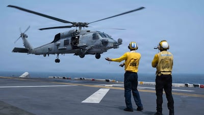 American service members aboard amphibious assault ship USS Boxer support flight operations day and night from the Arabian Sea, as the US enforces the naval blockade against Iran. Centcom
