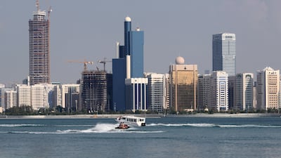 The Abu Dhabi skyline. UAE government revenues for the third quarter of this year increased to Dh148.1 billion according to the Ministry of Finance. Reuters