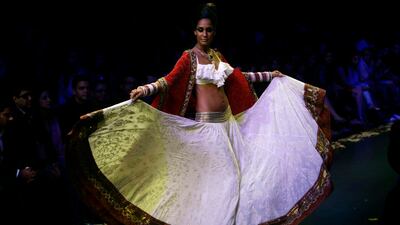 August 18, 2011: An Indian model displays designer Anita Dongre creations during the Lakme Fashion Week in Mumba AP Photo/Rajanish Kakade
