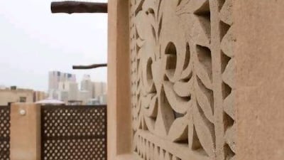 An intricately decorated window carved out of gypsum at Al Bastakiya.