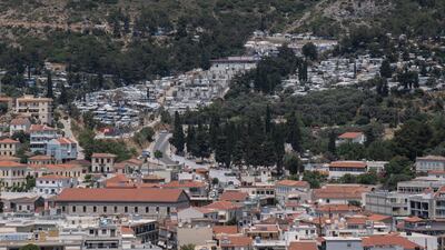 The port city of Vathy, on Samos island, and its refugee and migrant camp in the background. AP