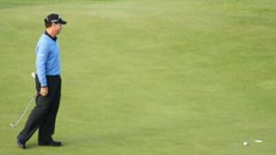 Tom Watson watches what would have been a title-winning putt come to rest inches short of the final hole in regulation play in the British Open.