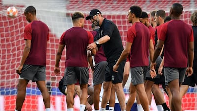 Klopp, centre, shares a joke with his players. AFP