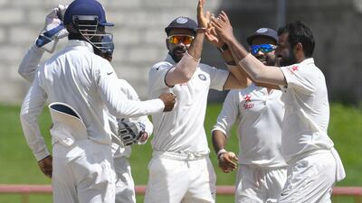 Victories by Virat Kohli, centre, Mohammed Shami, right, and India on the pitch have been overshadowed a bit by the difficulties the Board of Control for Cricket in India face within the country and with the International Cricket Council. Randy Brooks / AFP