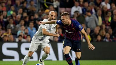 Barcelona midfielder Arthur, right, combines the best qualities of predecessors Xavi and Andres Iniesta. AP Photo