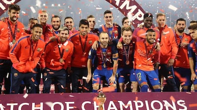 Barcelona players celebrate after winning the Match of Champions. Karim Jaafar / AFP