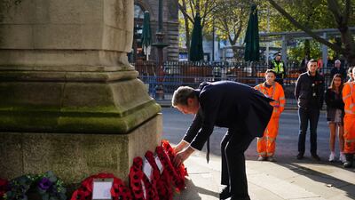 Labour leader Sir Keir Starmer lays a wreath at the war memorial at Euston Station in London. PA
