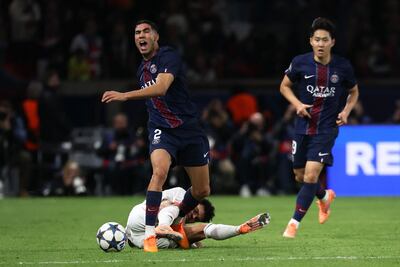 Paris Saint-Germain's Achraf Hakimi picked up an injury after a tackle from Bayern Munich's Luis Diaz. AFP
