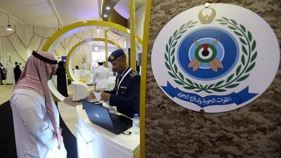 An Emirati man visits the GHQ Armed Forces stand during the Fujairah International Career and Education Fair. Satish Kumar / The National