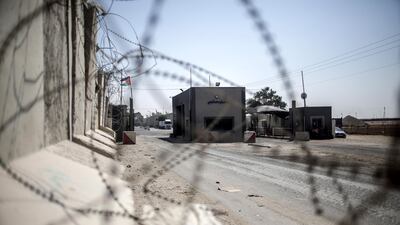 Palestinian trucks are seen at the gate of the Kerem Shalom crossing, the main passage point for goods entering Gaza, in Rafah town in the southern Gaza Strip, 17 July 2018. EPA