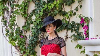 2. Black and red top Dh1,165 and skirt Dh2,145 by Jelena bin Drai; Christian Dior bag; Christian Louboutin shoes. Courtesy: Jelena bin Drai