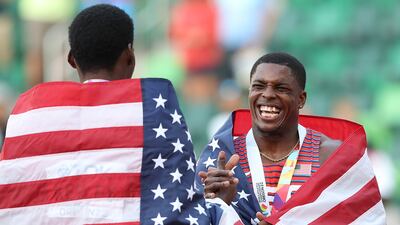 Gold medalist Fred Kerley and silver medalist Marvin Bracy of celebrate after the men's 100m final. AFP