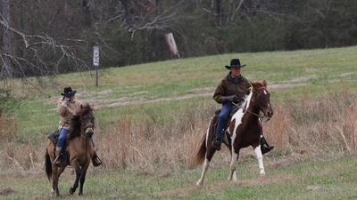 Roy Moore and his wife Kayla Moore ride on horseback to vote in Gallant, Alabama. Dan Anderson/ EPA