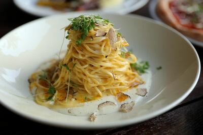 Tagliolini with Parmesan fondue, egg yolk sauce and truffle at Trattoria Toscana