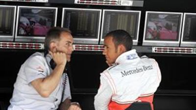 McLaren team boss Martin Whitmarsh talks to world champion Lewis Hamilton on the pitwall. The pair have suffered a frustrating year as McLaren have struggled for pace after a strong 2008.