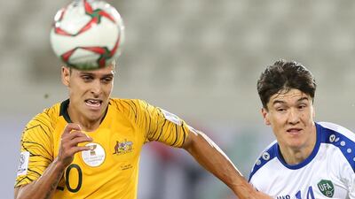 Trent Sainsbury of Australia, left, in action against Eldor Shomurodov of Uzbekistan during the 2019 Asian Cup last-16 match in Al Ain. EPA
