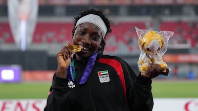 Mariam Kareem of the UAE bites her gold medal at the Asian Games. Getty Images