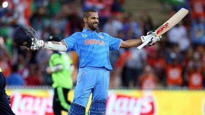 India's Shikhar Dhawan celebrates his century against Ireland on Tuesday in his team's victory at the 2015 Cricket World Cup. Michael Bradley / AFP / March 10, 2015