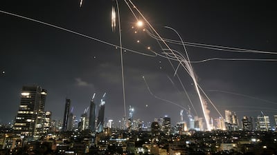 Israel's Iron Dome air defence system is sent to intercept missiles over Tel Aviv. AP