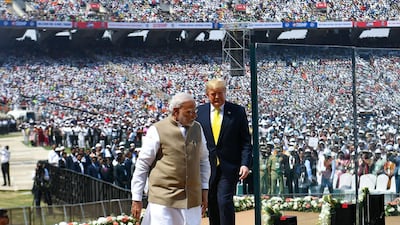 US President Donald Trump and India's Prime Minister Narendra Modi arrive to attend 'Namaste Trump' rally at Sardar Patel Stadium in Motera. AFP