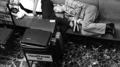 Passengers asleep in the passenger lounge at Heathrow during delays caused by industrial action by French air traffic controllers. Getty