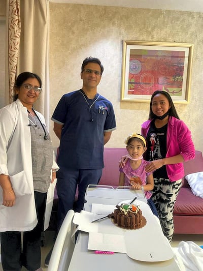 Althea Faye Barabacina and her mother with Dr Pinkesh Laxmikant Thakkar and Dr Jamuna Raghuraman after recovery at Medeor Hospital Dubai. Courtesy Medeor Hospital