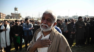Mourners at the funeral of a victim of a suicide bombing at a mosque in Islamabad. AFP