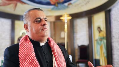 Father Rifat Badr who leads his church in Naour, Jordan, has praised the government for making 'Jordanians one family'. Salh Malkawi for The National