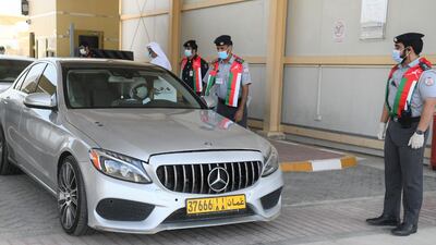 Those arriving in Abu Dhabi were welcomed by police officials to celebrate the return of traffic via road between the two countries.