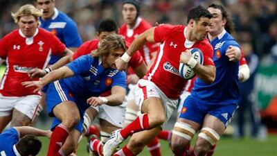 Wales' Mike Phillips evades a tackle from Dimitri Szarzewski at the Stade de France.