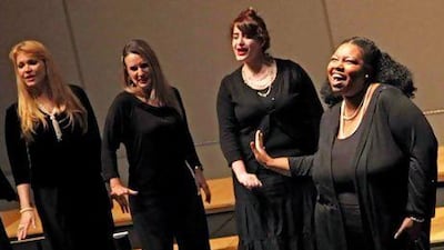 Some of the members of Voices of Harmony, the city's only all-women barbershop singing group. Kelly Brbich and Tiffany Schulze