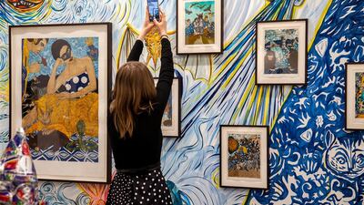 A visitor at India Art Fair photographing Marcel Dzama's work at David Zwirner's booth. Courtesy India Art Fair 2020