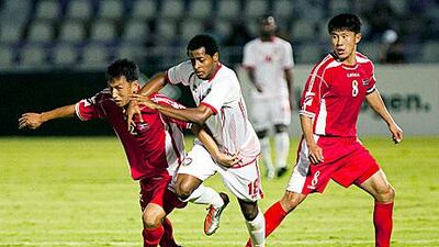 Mohamed Abdalla tries to get past a North Korean defender.