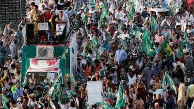Supporters of the Pakistan Muslim League - Nawaz (PML-N) chant and march towards the airport to welcome ousted Prime Minister Nawaz Sharif and his daughter Maryam, in Lahore, Pakistan. Reuters
