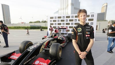 Romain Grosjean and the Lotus team took time out to address the press and sponsors at the base of Burj Khalifa, Dubai. Jaime Puebla / The National