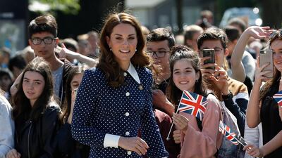 The Duchess of Cambridge wears a pleated polka-dot silk crepe de chine midi dress by Alessandra Rich, with Emmy London Rebecca pumps, a Smythson Panama Clutch, an antique broach which belonged to her grandmother and Kiki McDonough earrings to visit the D-Day exhibition at Bletchley Park on May 14. Getty Images