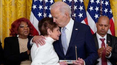 US President Joe Biden presents the Presidential Citizens Medal to Capitol Police Officer Brian Sicknick's mother during a ceremony to mark the second anniversary of the January 6 assault on the Capitol. AP