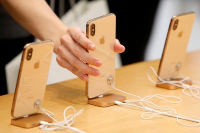 Apple Stores offer battery replacement services from Dh189. Reuters