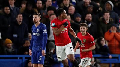 Anthony Martial celebrates scoring their first goal with Daniel James as Chelsea's Jorginho looks dejected. Reuters