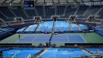 Dutch player Arantxa Rus, right, returns a shot from Serena Williams of the US in front of empty stands at the Southern Open in New York, on Monday, August 24. AP