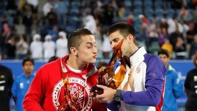 Nicolas Almagro, left, took a set off Novak Djokovic in Saturday's final despite being invited to play in Abu Dhabi at the 11th hour. Mike Young / The National