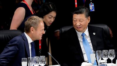 Xi Jinping, China's president, talks with Donald Tusk, president of the European Union. AFP