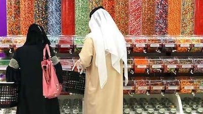 Shoppers choose sweets at the Candylicious candy store at Dubai Mall.