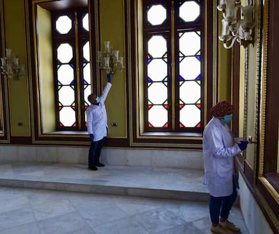 Restoration workers add finishing touches to one of the Mohamed Ali Palace's many rooms