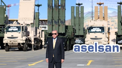 Turkish President Recep Tayyip Erdogan poses with surface-to-air missiles at the headquarters of defence giant Aselsan. Reuters